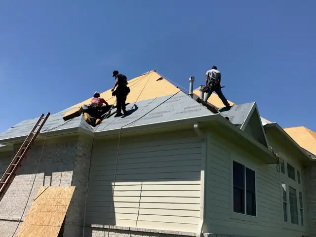 Crew working on a fresh roof deck